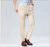 Detail of slim-fit dress pants waistband with belt loops and zipper fly construction