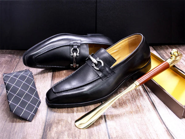 Back heel view of Midnight Poise black leather loafers