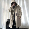 Stylish men's mid-length trench coat with hood, big pockets, and windproof features for autumn and spring outdoor wear.
