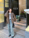 Chic genuine leather jacket for women, zippered blazer, tailored fit, perfect for autumn and winter casual or formal wear.