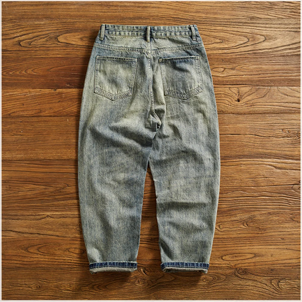 Close-up of Rebel Spirit Distressed Jeans showcasing the artfully placed rips and texture.