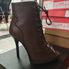 Sleek stiletto ankle boots with striking snake-print leather finish