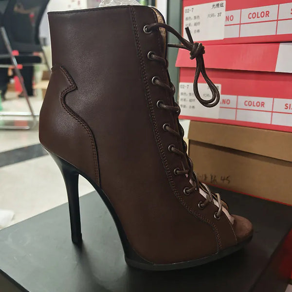 Sleek stiletto ankle boots with striking snake-print leather finish