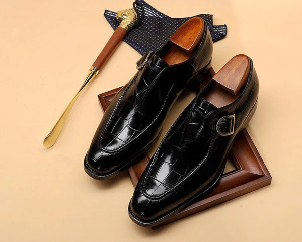 Professional footwear: carved Oxford shoes for business attire.