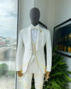 White plaid blazer with sharp lines, tailored for a dapper wedding look.