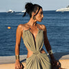 Ankle-length formal dress with halter neck, bare back, and strategic waist cutouts