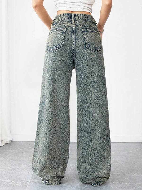 Model wearing Sunset Boulevard wide-leg jeans styled with a snug top.