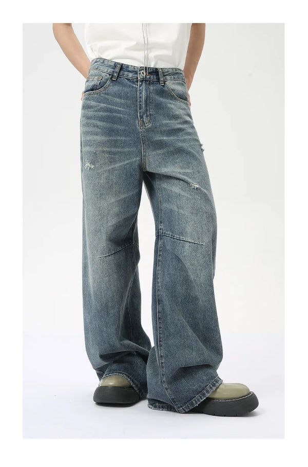 Washed blue wide leg jeans featuring softened denim and practical pockets