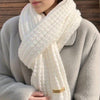 Cozy cashmere-blend winter scarf showcasing its thick, tactile knit.