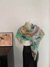 Soft polyester square scarf, ideal for adding sophistication to everyday outfits.