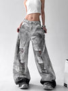 Trendy high-waist wide-leg ripped jeans for women with tie-dye and distressed detailing, perfect for casual street style.