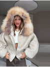 Plush hooded jacket with generous hood for wind protection