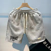 Knee-length polyester shorts for men with breathable knit construction and eye-catching print design