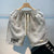 Knee-length polyester shorts for men with breathable knit construction and eye-catching print design
