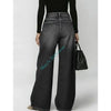 High waisted wide leg jeans with retro wash finish and edgy metal hardware details