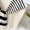 Fashionable lightweight scarf with classic stripes for autumn style.