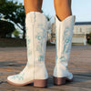 Embroidered mid-calf women's fashion boots with low wedge heel, slip-on design, and durable rubber outsole for comfort and st