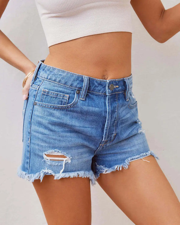 Versatile ripped denim shorts with comfortable stretch and vintage-inspired button fly