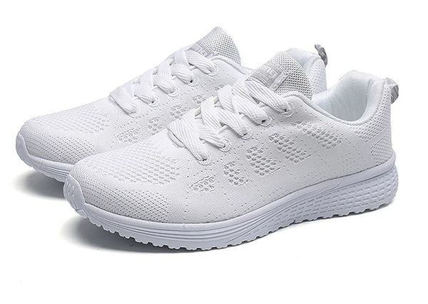 Cushioned white athletic sneakers with multi-color details for active wear
