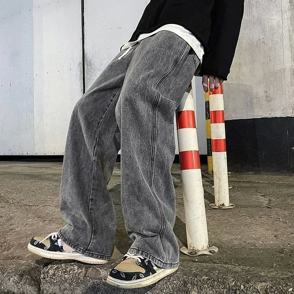 Comfortable men's denim jeans featuring elastic waistband and loose straight cut