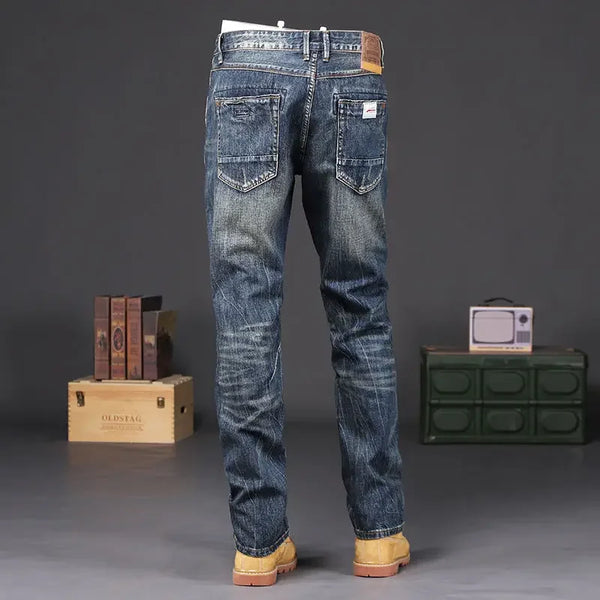 Close-up of men's vintage wash straight jeans showcasing durable zipper fly.