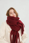 Thick winter scarf in cream color, perfect for chilly days.