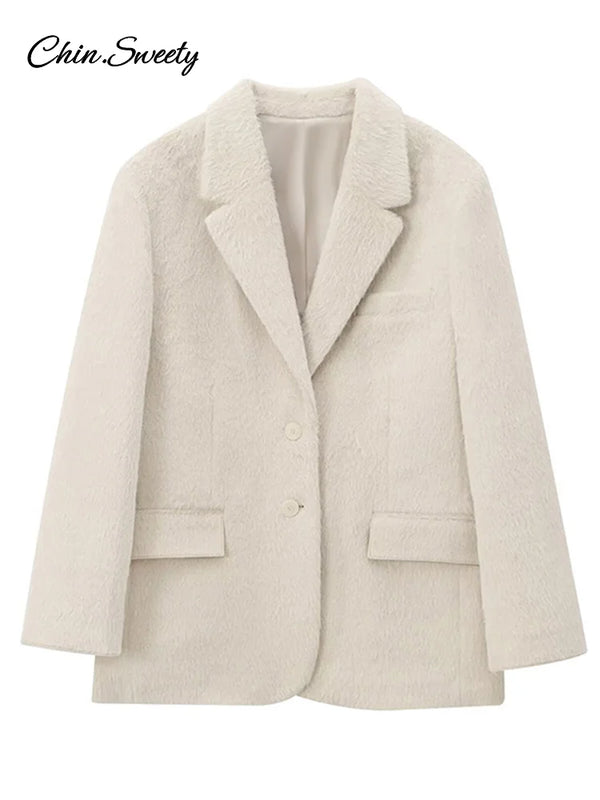 Woman wearing creamy white mohair blazer with turn-down collar styled over casual outfit for autumn