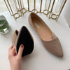 Woman wearing knitted ballet flats with flowing dress for spring outfit inspiration