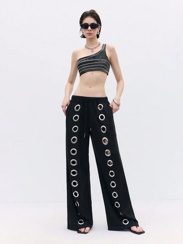 Unisex streetwear pants featuring Y2K hollow design, relaxed fit, and drawstring waist in polyester-elastane blend