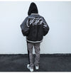 Chic Embroidered Leather Baseball Jacket in Black - Stylish and trendy PU leather jacket with embroidered design and zipper placket.