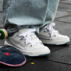 Women's White Canvas Skate Shoes with English Muffin Heel and Totem Design